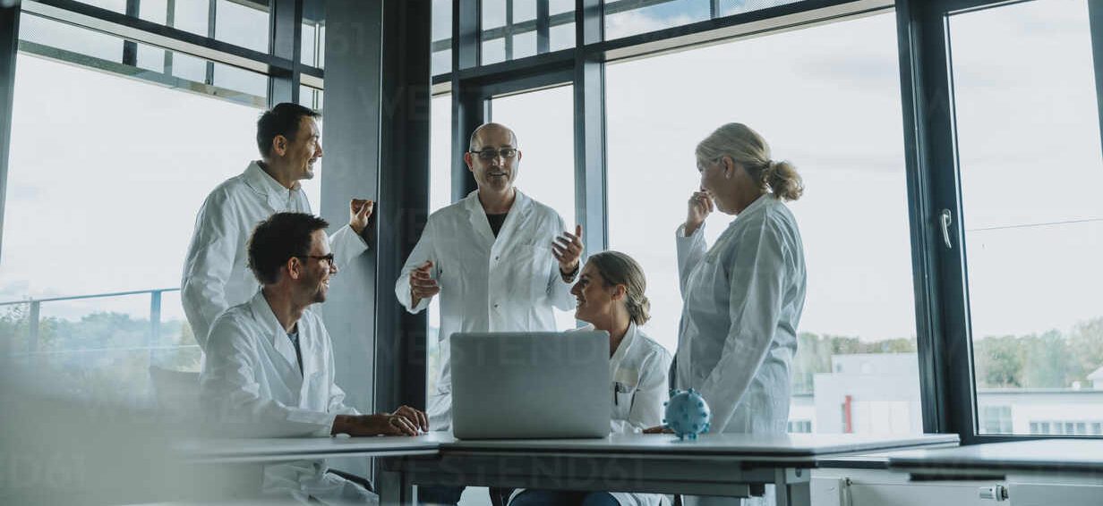 Scientists and doctors discussing findings about a virus, NRW, Germany